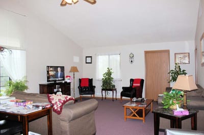 Cozy common area with comfortable seating and plants