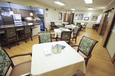 Dining area with tables and chairs in a facility