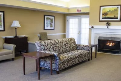 Cozy lounge area with a fireplace and seating
