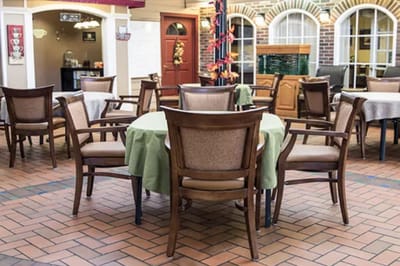 Dining area with empty chairs and tables