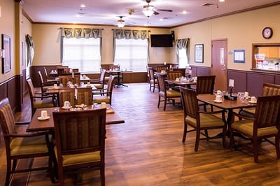 Dining room with tables set for breakfast