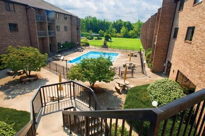 Aerial view of a communal pool area surrounded by buildings