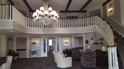 Interior of a bright lobby with a chandelier