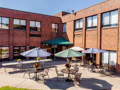 Outdoor seating area with umbrellas and flowers