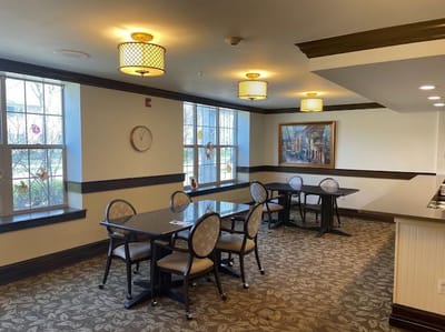 Bright common area with seating and tables