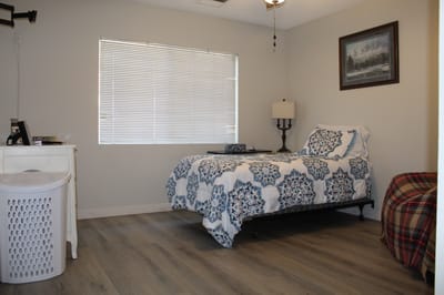 A furnished resident room in a care facility