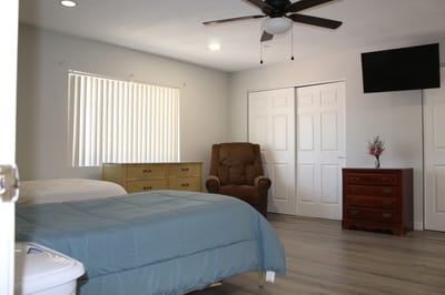 Bright interior of a resident room with furniture