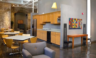 Modern common area with seating and kitchen
