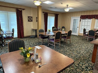 Dining room with tables and floral centerpieces