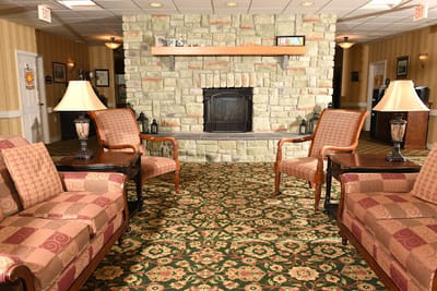 Cozy lounge area with comfortable seating and a fireplace