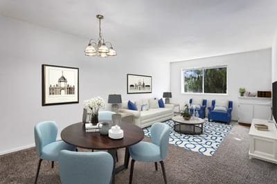 Bright, well-furnished living room in a senior facility apartment