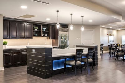 Modern dining area with kitchen and seating