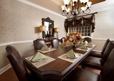Elegant dining room set with floral centerpiece