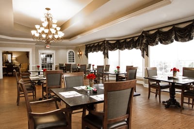 Well-furnished dining room with tables and chairs