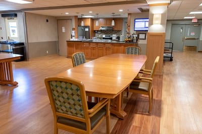 Bright dining area with wooden tables and chairs