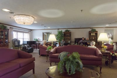 Residents enjoying music in a cozy lounge area