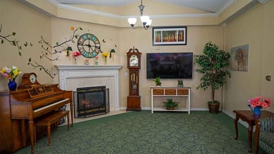 Cozy common area with seating and a piano