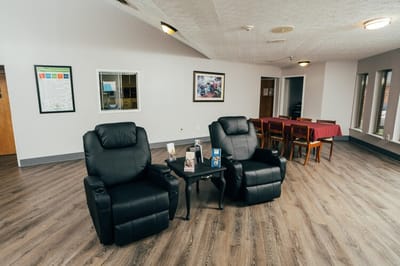 Cozy common area with recliners and dining table