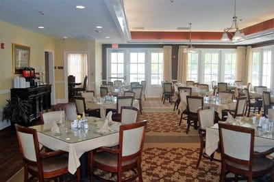 Bright dining room setup with tables and chairs