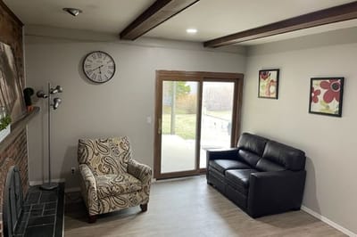 Bright common area with seating and outdoor view