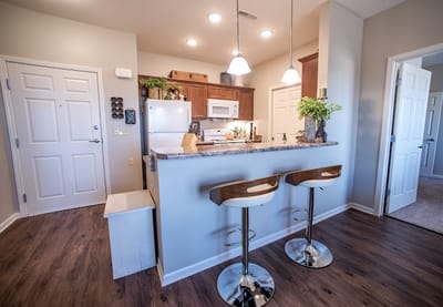 Modern kitchen area with bar stools