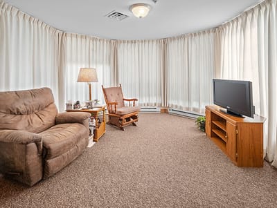 Cozy sitting area with armchairs and curtains