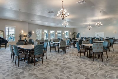 Common area with tables and chairs for activities