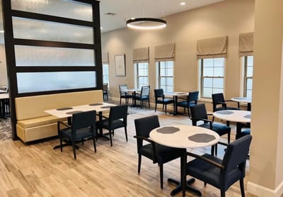 Bright dining area with tables and chairs
