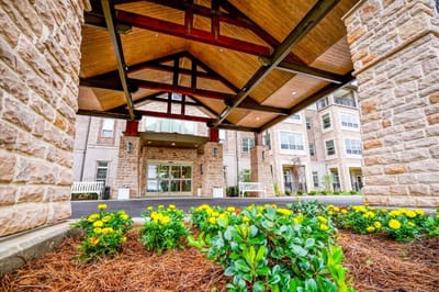 Entrance of the facility with landscaped flowers