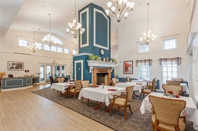 Bright dining area with tables and chandeliers