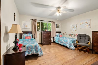 Cozy shared resident room with two beds and decor