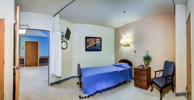 A private resident room with bed and furnishings