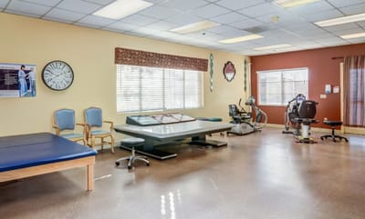 Interior view of a physical therapy room with equipment