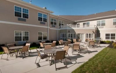 Outdoor seating area with tables and chairs