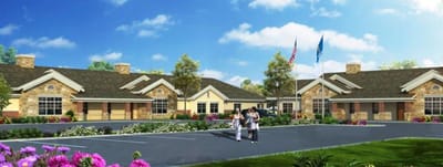 Exterior view of the facility with residents walking