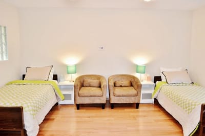 Cozy resident room with two beds and seating