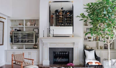 A cozy common area with a fireplace and decor