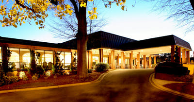 Front entrance of Hillcrest Convalescent Center at dusk