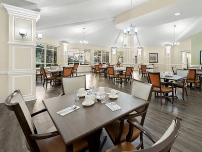 Bright dining room with tables and chairs