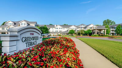 Exterior view of Greenwood Terrace with colorful flowers