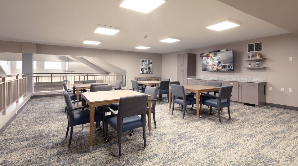 Empty common area with tables and chairs