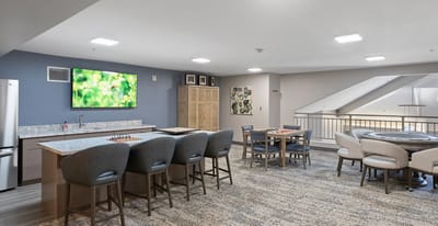 Bright interior common area with seating and games