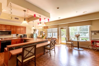 Bright dining area with kitchen and seating