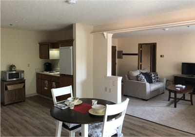 Interior view of a cozy resident unit with dining area