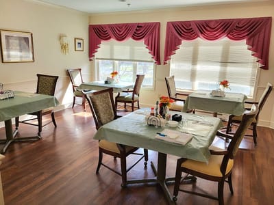 Dining area with tables set for residents