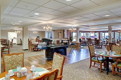 Bright dining room with tables and chandeliers