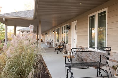 A well-maintained porch area with seating