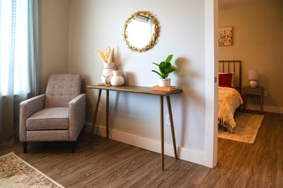 Cozy interior room featuring a chair and bed