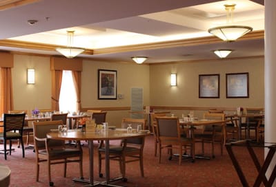 Interior view of a dining room with tables and chairs