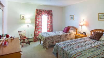 Brightly decorated shared bedroom with two beds